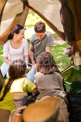 Happy family camping in the park