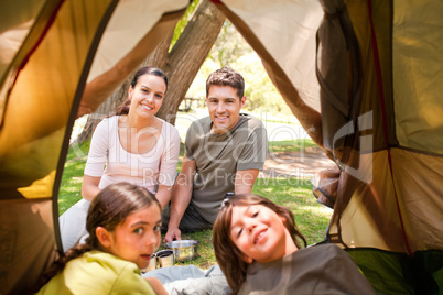 Happy family camping in the park