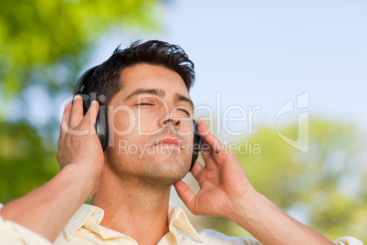 Man listening to music in the park