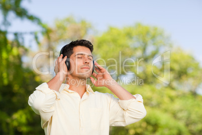 Man listening to music in the park