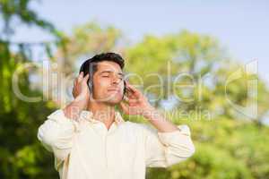 Man listening to music in the park
