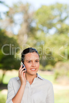 Woman phoning in the park