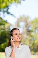 Woman phoning in the park