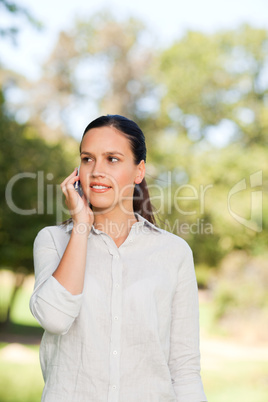 Woman phoning in the park