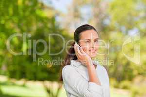 Woman phoning in the park