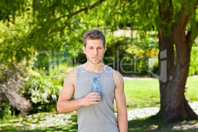 Sporty handsome man in the park