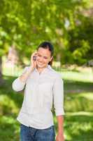 Young woman phoning in the park