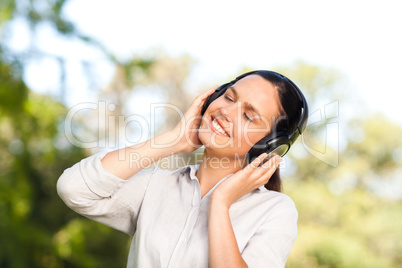 Beautiful woman listening to music