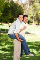 Man giving wife a piggyback