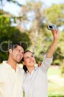 Young couple taking a photo of themselve