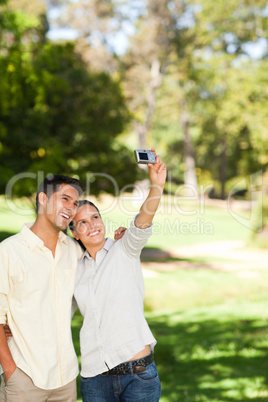 Young couple taking a photo of themselve