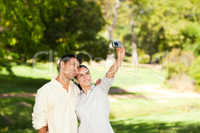 Young couple taking a photo of themselve