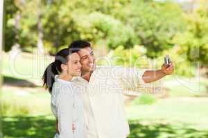 Young couple taking a photo of themselve
