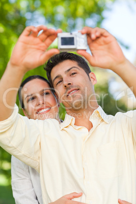 Couple taking a photo of themselve