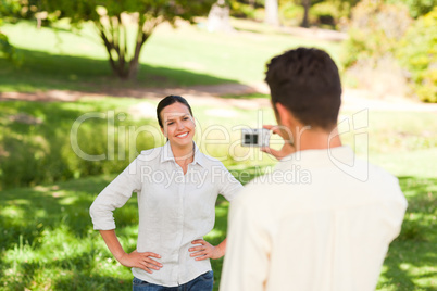 Man taking a photo of his girlfriend