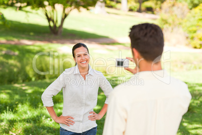 Man taking a photo of his girlfriend