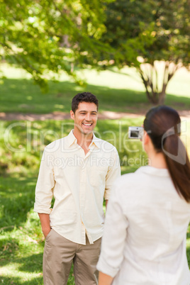 Woman taking a photo of her boyfriend