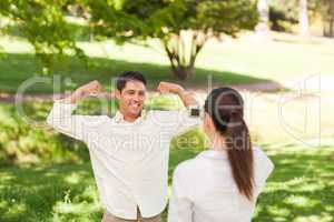 Woman taking a photo of her boyfriend