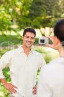 Woman taking a photo of her boyfriend