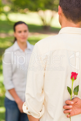 Man offering a rose to his girlfriend