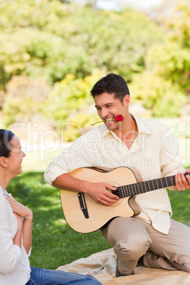 Handsome man playing guitar