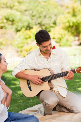 Handsome man playing guitar