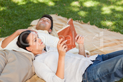 Couple reading in the park