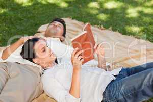 Couple reading in the park