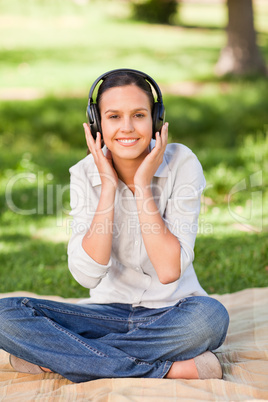 Happy young woman listening to music