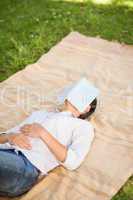 Woman sleeping with her book
