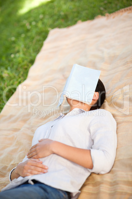 Woman sleeping with her book