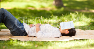 Woman sleeping with her book