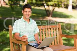 Handsome man working on his laptop