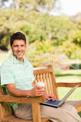 Handsome man working on his laptop