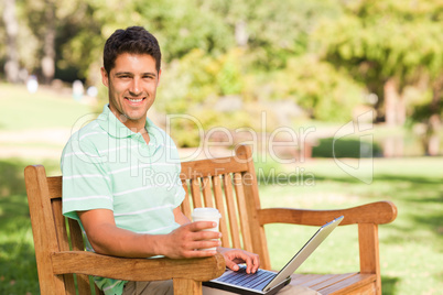Handsome man working on his laptop Handsome man working on his laptop