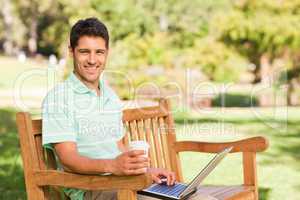 Handsome man working on his laptop