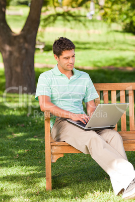 Handsome man working on his laptop