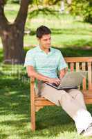 Handsome man working on his laptop