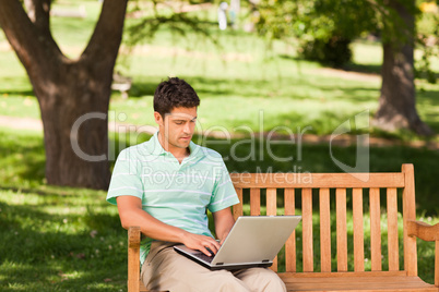 Handsome man working on his laptop