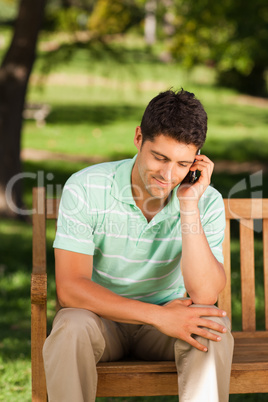 Young handsome man phoning