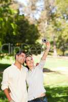 Couple taking a photo of themselve