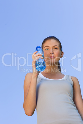 Young woman drinking water