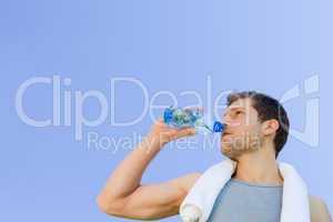 Man drinking water after the gym
