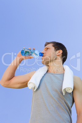 Man drinking water after the gym