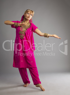 Dancer stand in rose oriental indian costume