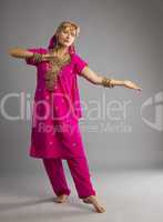 Dancer stand in rose oriental indian costume