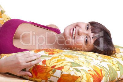 woman lay on pillow and smile
