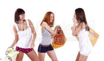 Three young woman in pillow fight