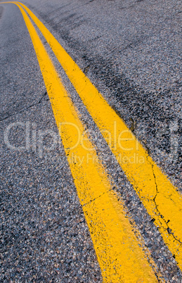 yellow dividing lines on the highway.