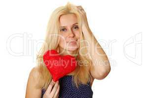 Young woman holding red heart